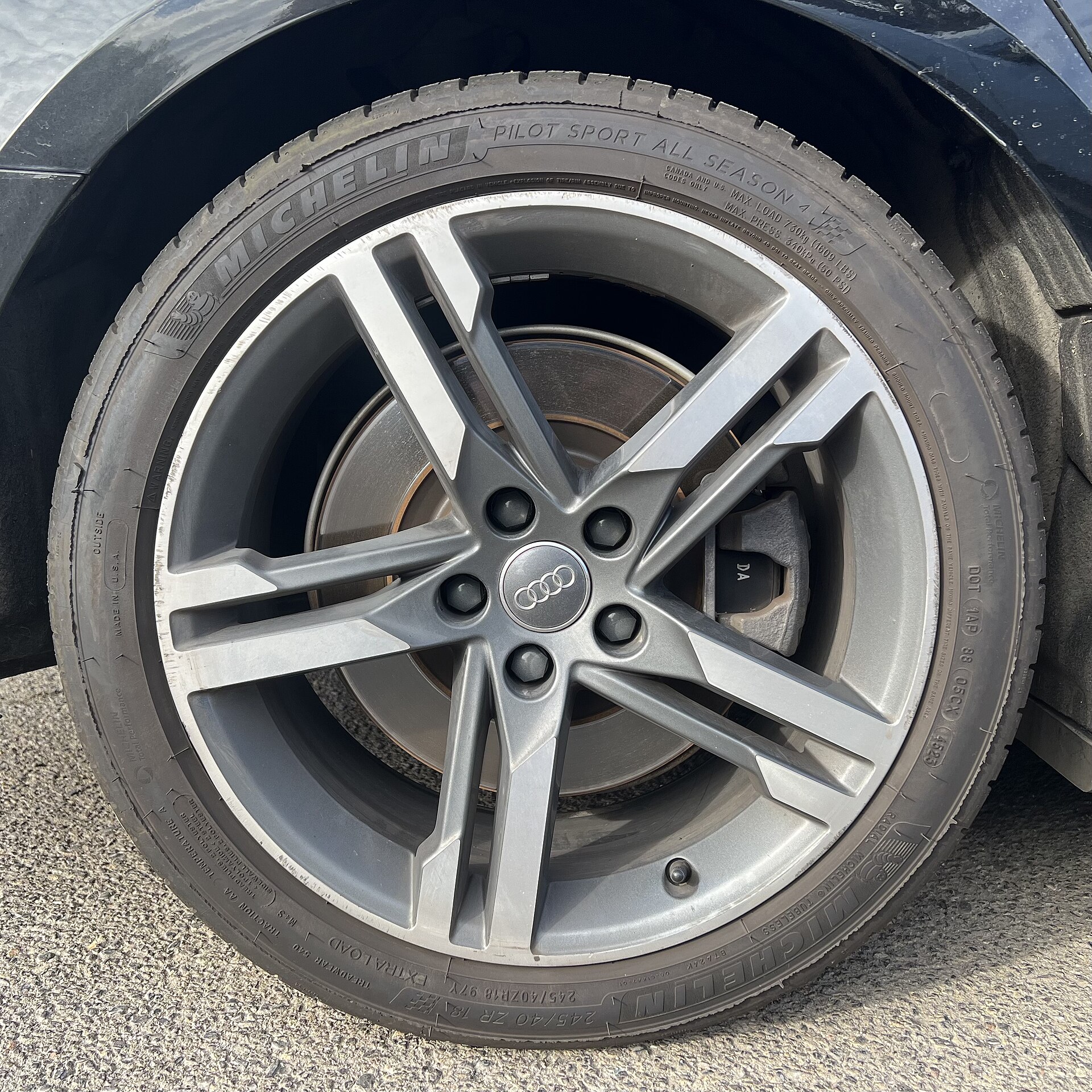 A Michelin Pilot Sport All Season tire is shown on an Audi wheel.