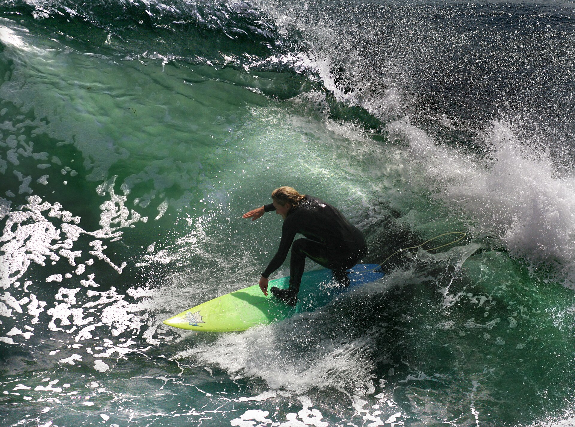 A surfer rides a wave, showcasing the thrill of action and adventure on television.